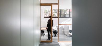 Big house with snow on the ground and roof